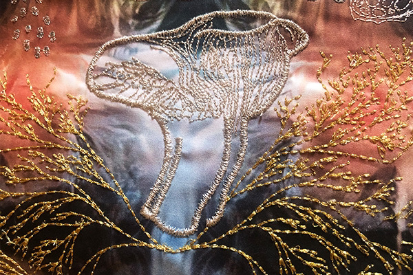 A detail image of embroidered textiles created by Kate Geck using generative machine learning models called Myccorhizal Materialities. Hand drawings of Australian fungi were used to train the machine learning models and transposed into embroidery designs.
