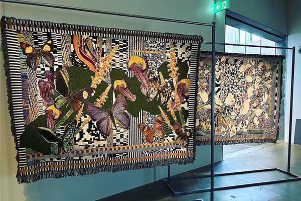 An installation of art work by Kate Geck titled Impossible Evolutions which uses machine learning models to generate digital images of endangered Victorian plants and weave them into tapestries. Artwork exhibited at RMIT Design Hub for Wild Hope 2023 as part of Now or Never festival